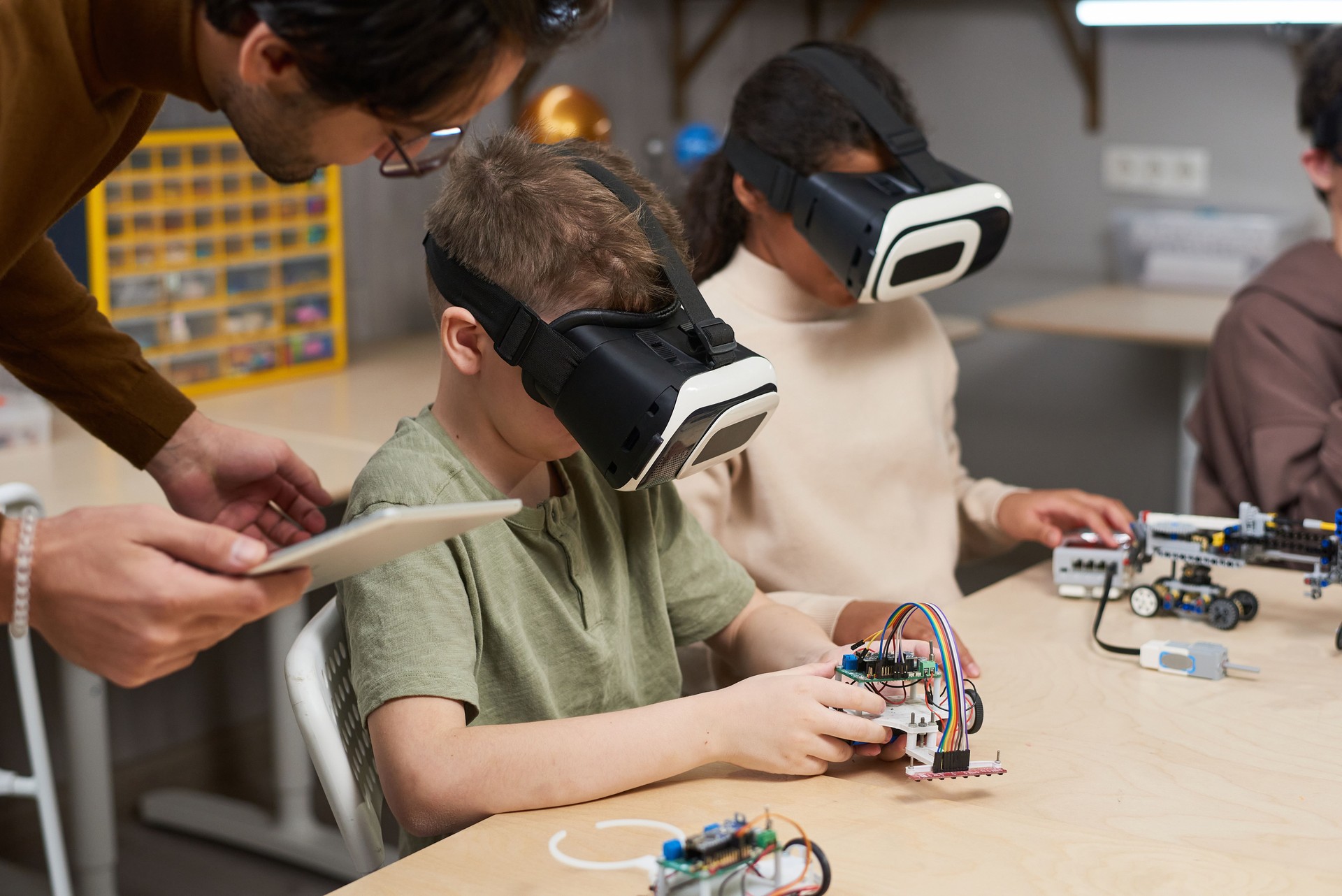 Children making robots in vr glasses